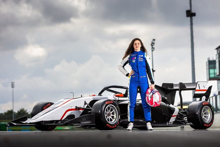 Woman with formula 1 car